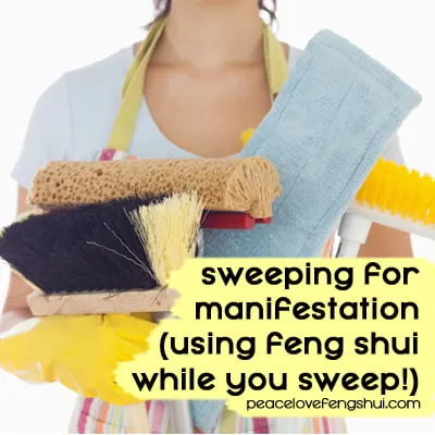 woman holding cleaning supplies - sweeping for manifestation