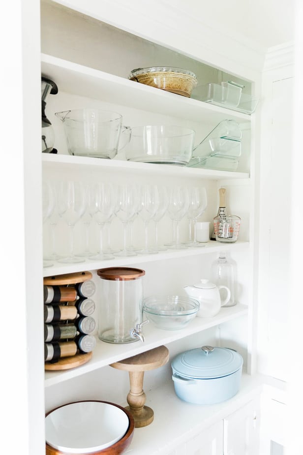 kitchen cabinet with spices and glassware