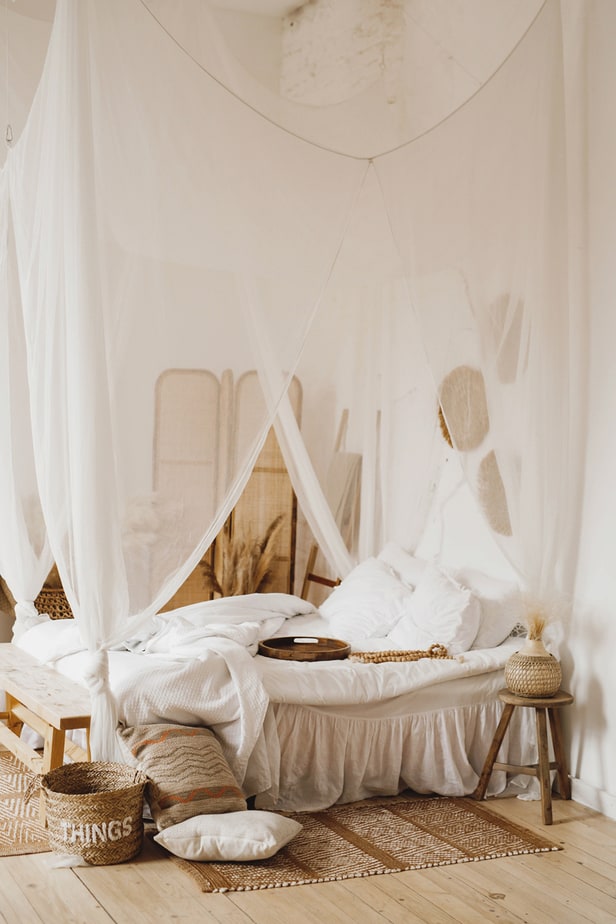 bed with pillows and baskets