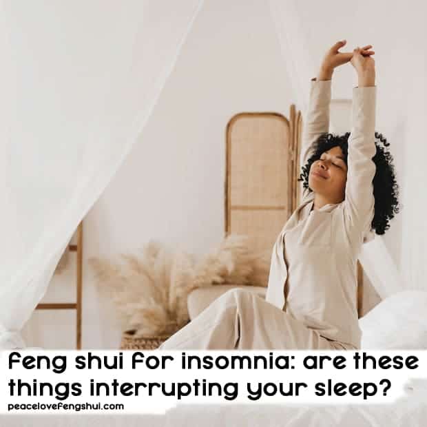 woman in bed stretching her arms - feng shui for insomnia: are these things interrupting your sleep