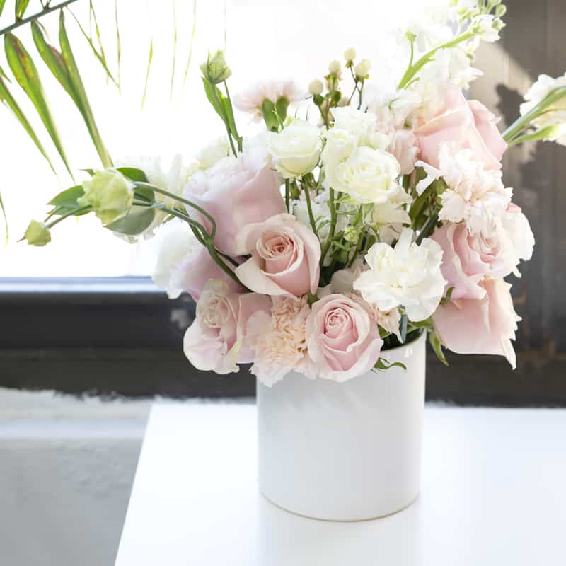 pink and white flowers in a vase