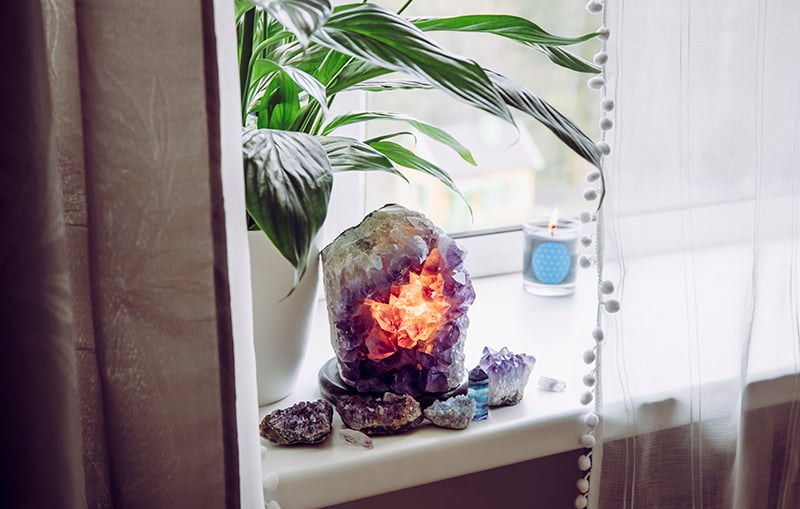 amethyst lamp next to a houseplant