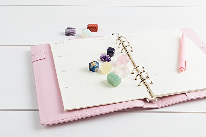 crystals on top of weekly planner
