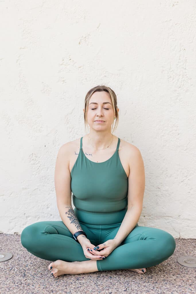 woman meditating with eyes closed