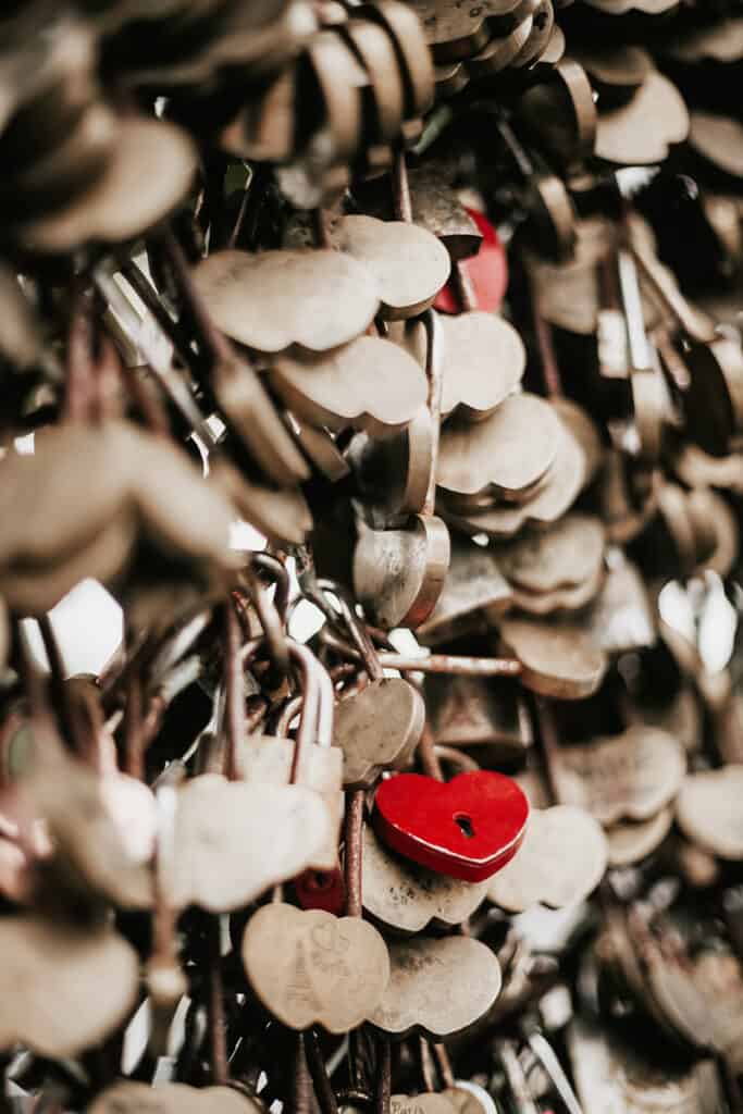 red heart lock among silver heart locks