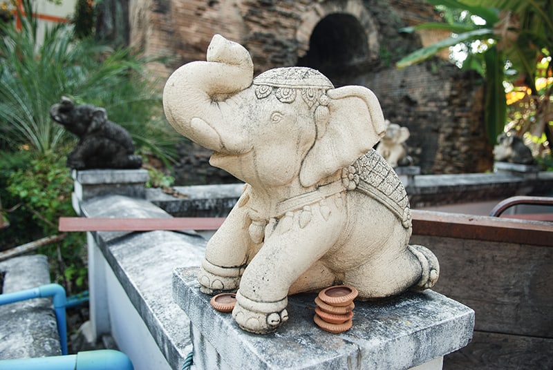 elephant statue outside a temple