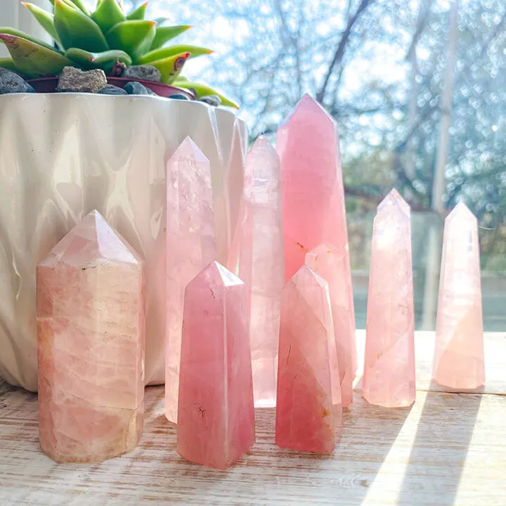 rose quartz towers in front of a window