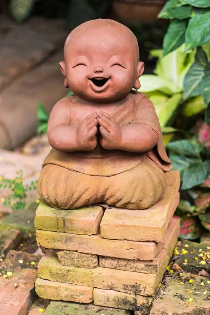 Laughing Baby Buddha Statue in the garden