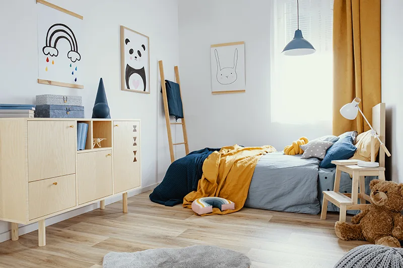 cozy child's bedroom with muted colors and artwork