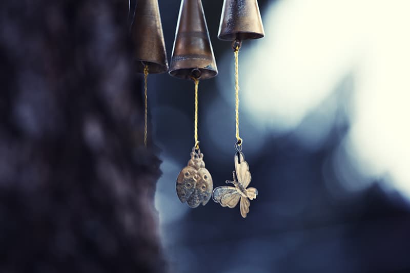 wind chimes with a lady bug and butterfly decoration