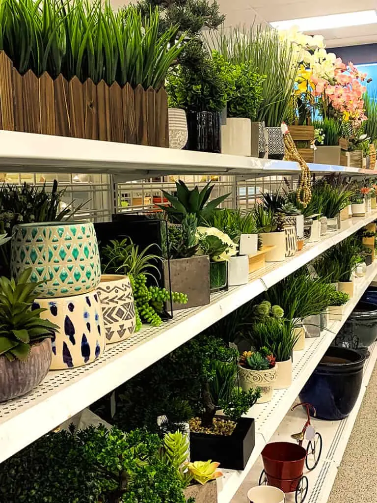 store shelves with a wide variety of fake and artificial plants