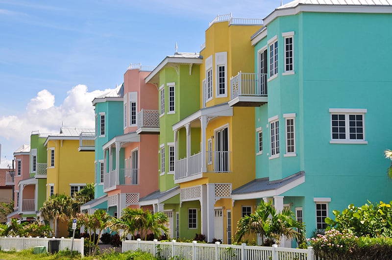 beach houses with bright exterior paint colors - pink, green, teal, and yellow