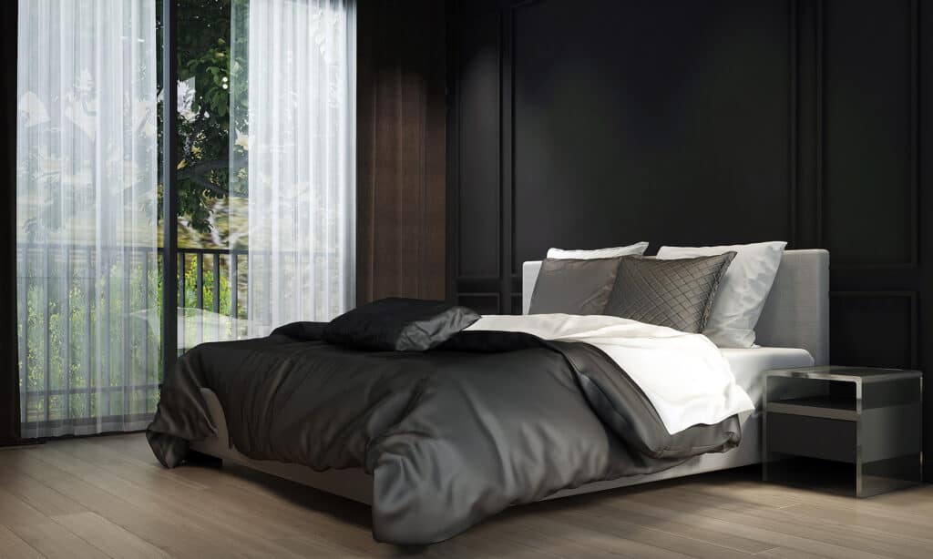 bedroom with black walls and black bedding