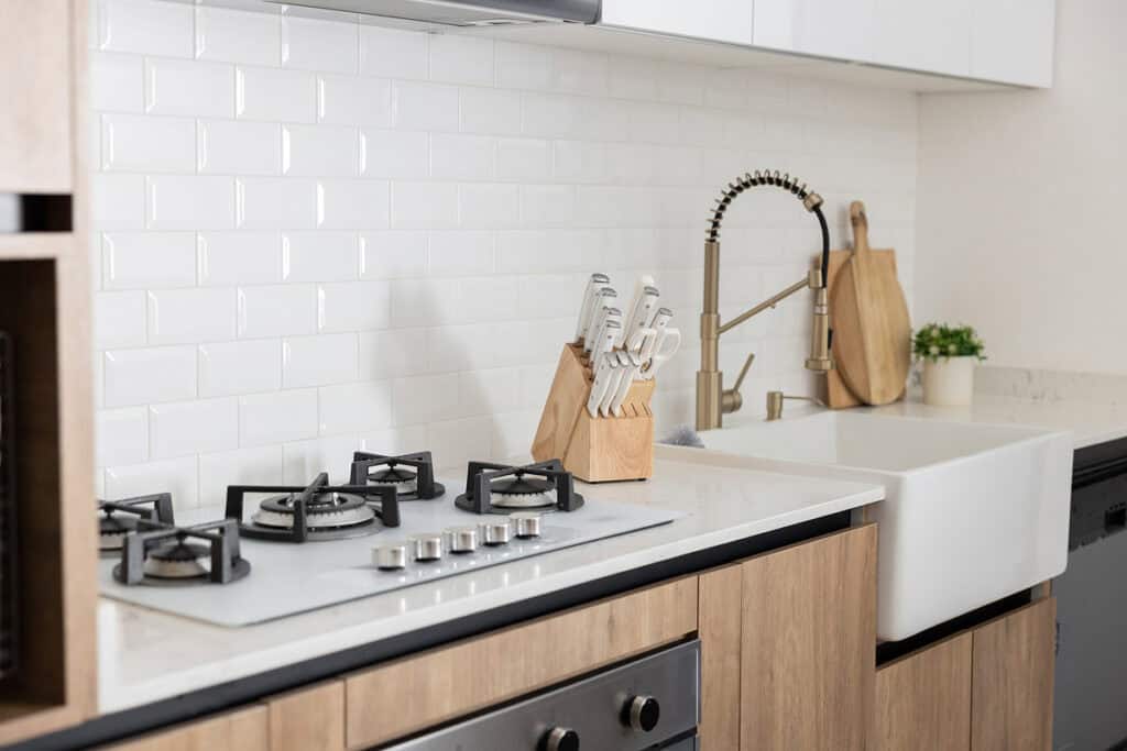kitchen counter, stovetop, and sink