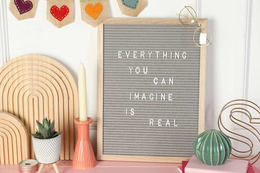 letter board that says "everything you can imagine is real"