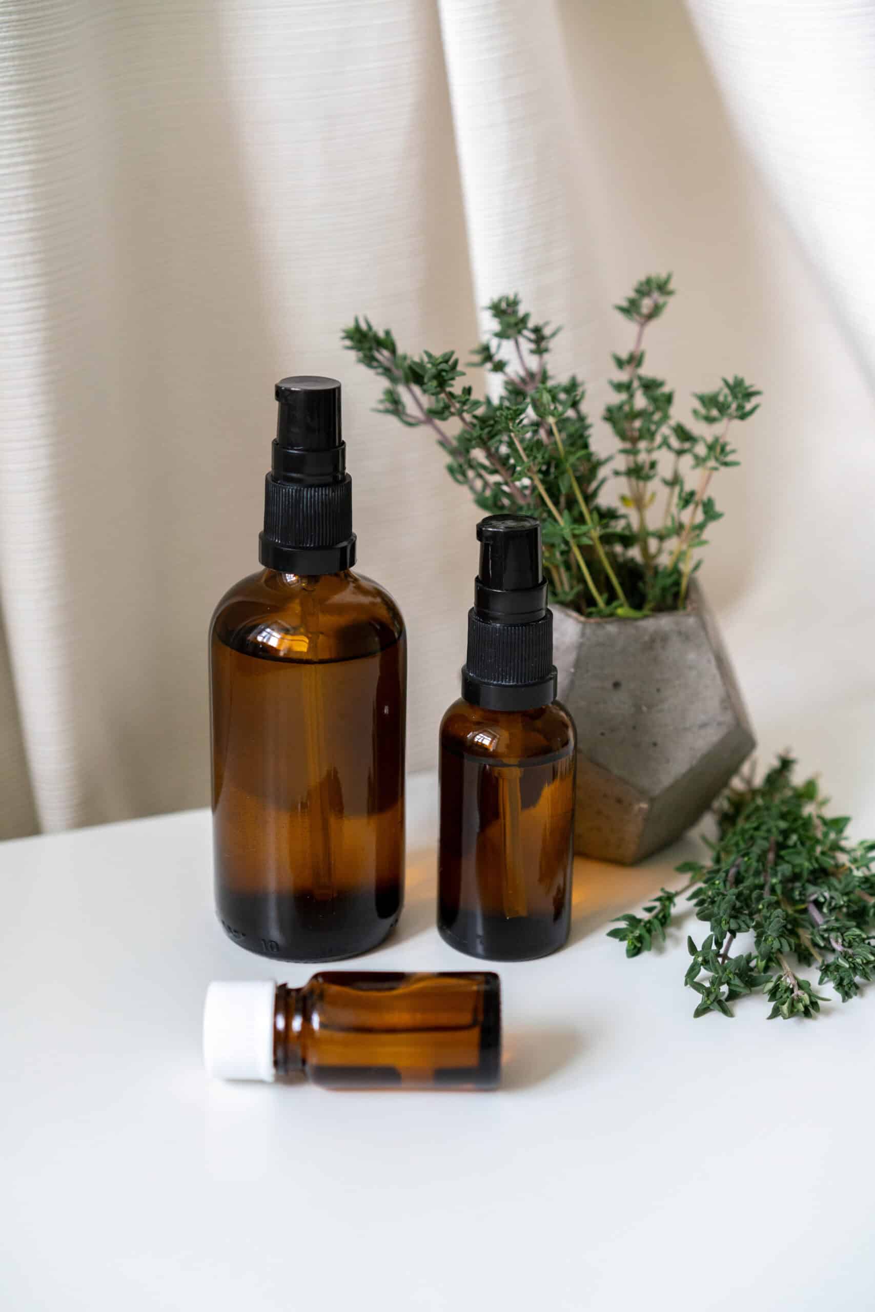 amber bottles full of sage cleansing spray