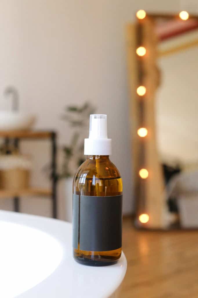amber bottle with sage spray