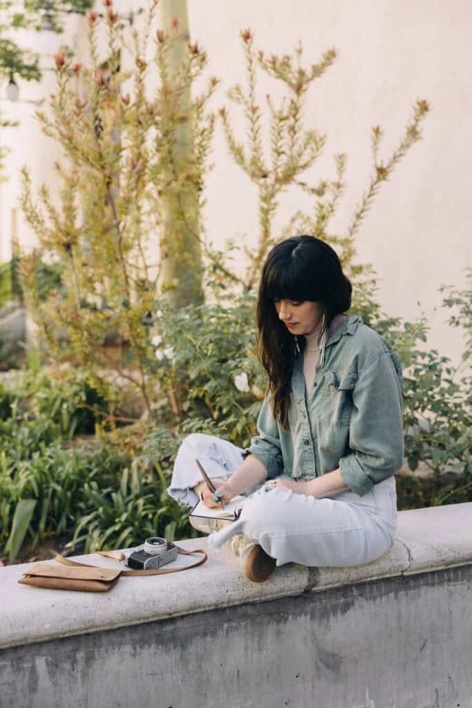 woman journaling outside