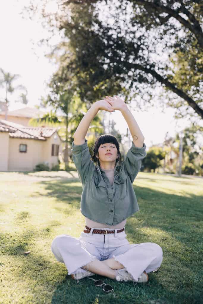 woman meditating outside